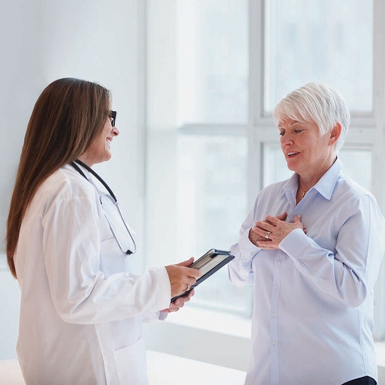 Female doctor talking to female patient