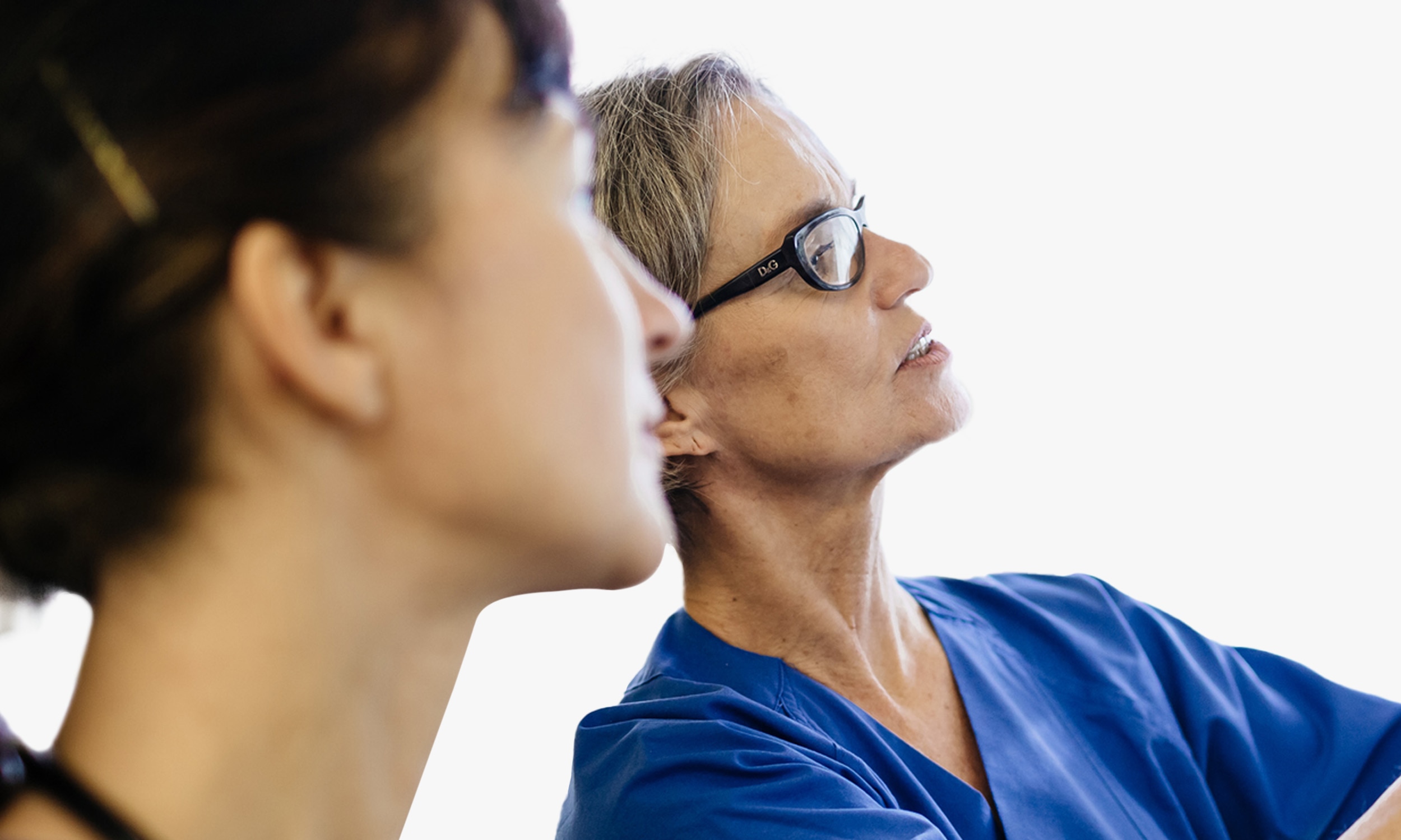 Female physician looking at a screen.