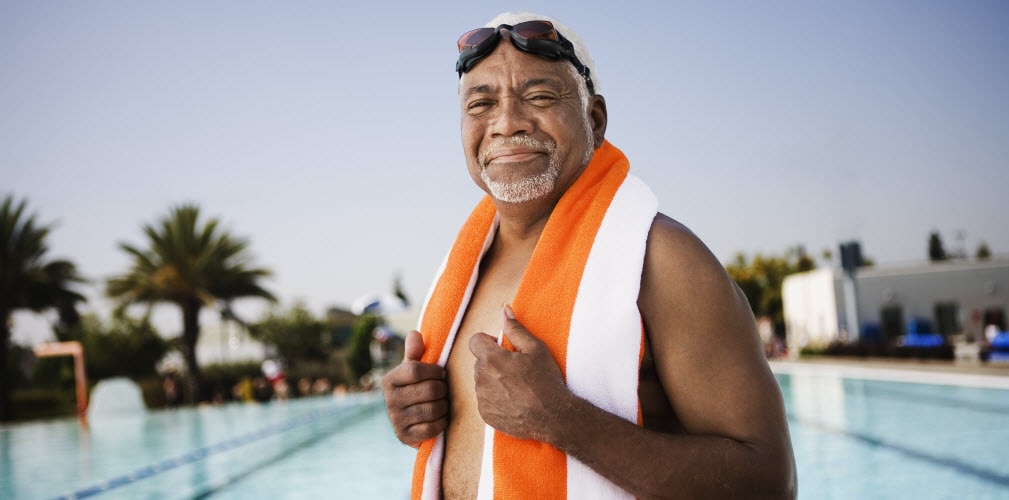 Male at Pool with Orange Towel