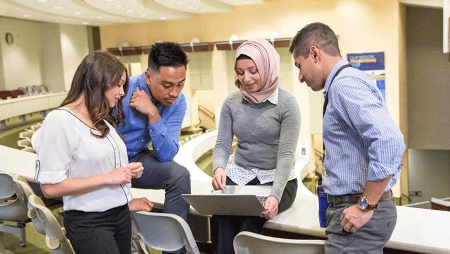 Photo of Younger Medtronic Employees Meeting