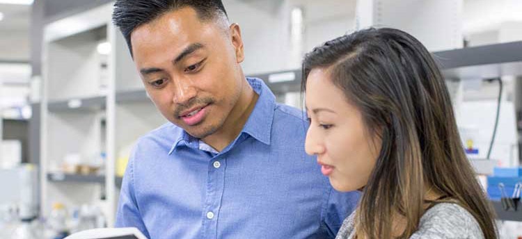 Woman and man doing research and development in a lab